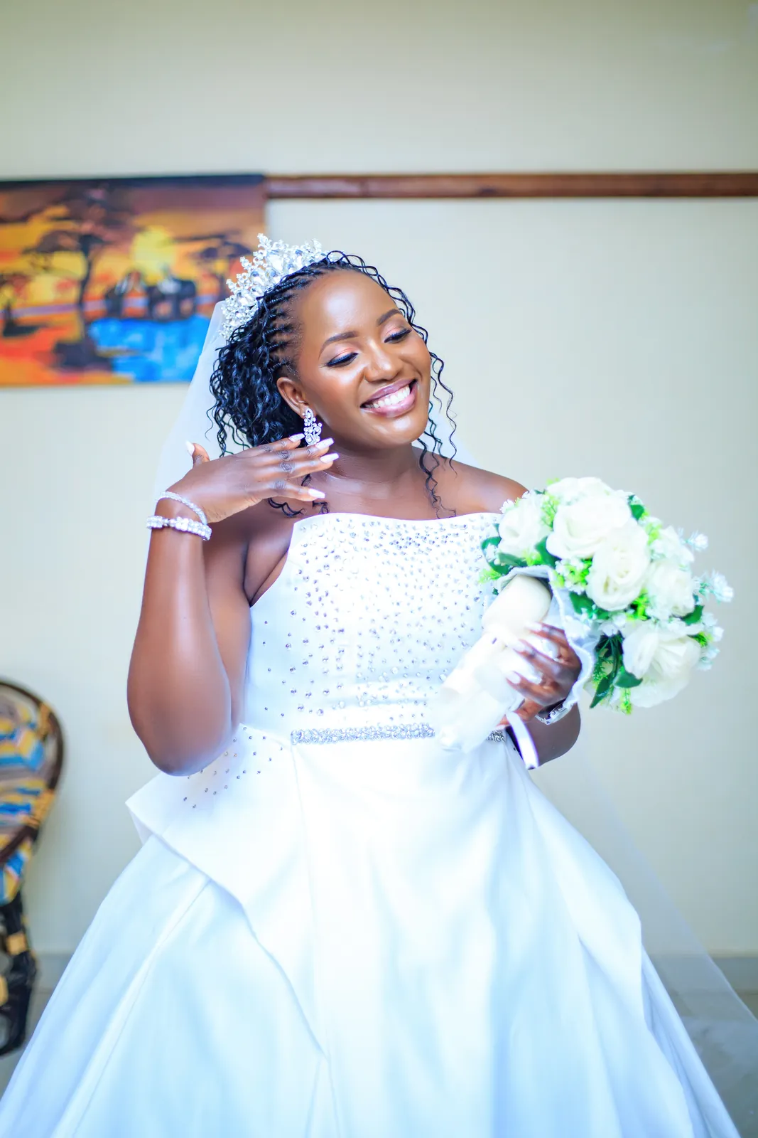 Portrait of a bride holding her bouquet, wedding photography by Mbale Digital Services