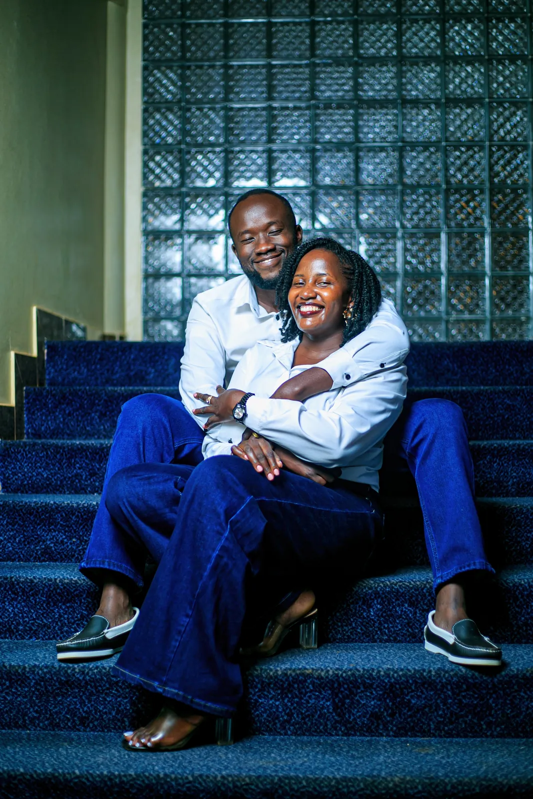 Couple sitting together on steps during a couple shoot