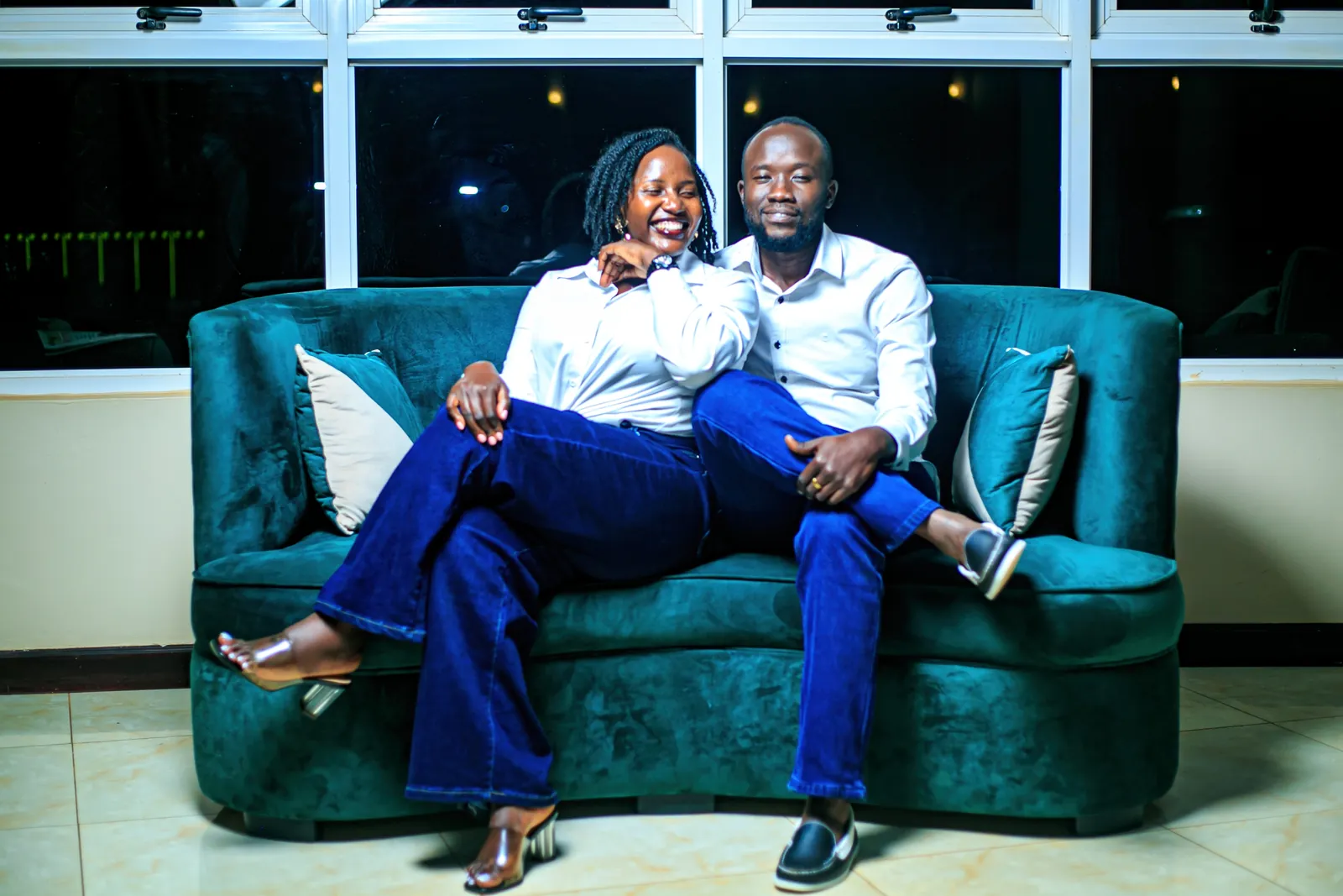 Couple relaxing on a sofa during a pre-wedding shoot
